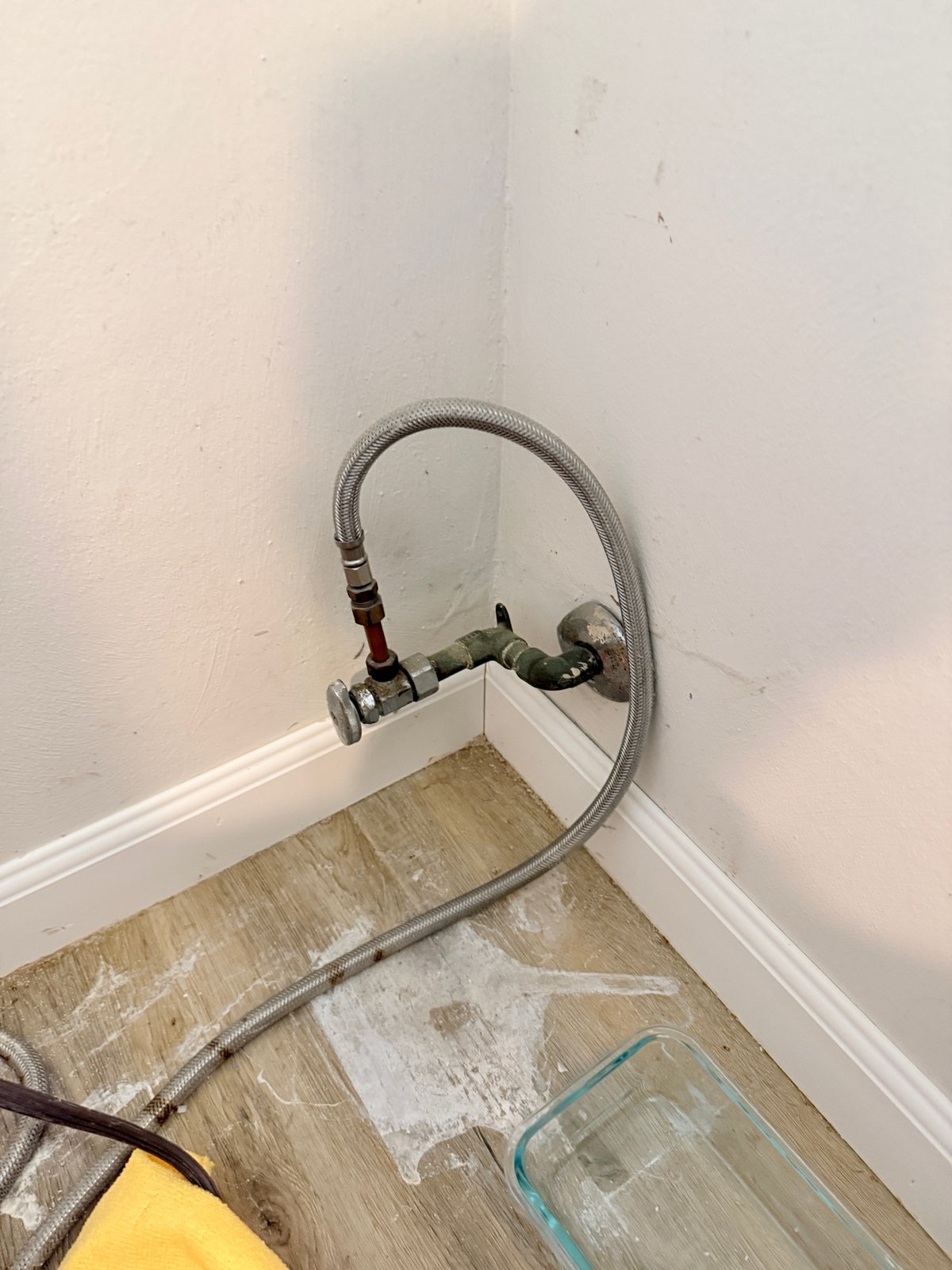 Documented plumbing shut-off valve with a braided stainless-steel supply line.